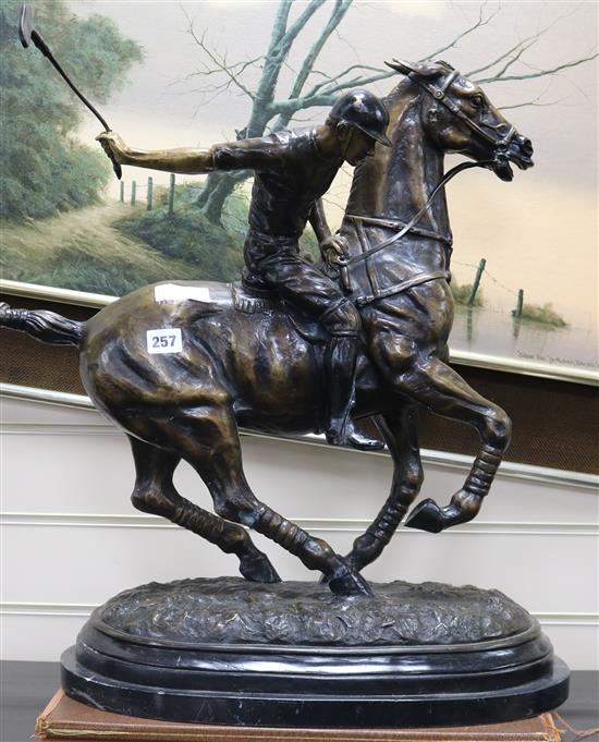 A bronze group of a polo player height 62cm